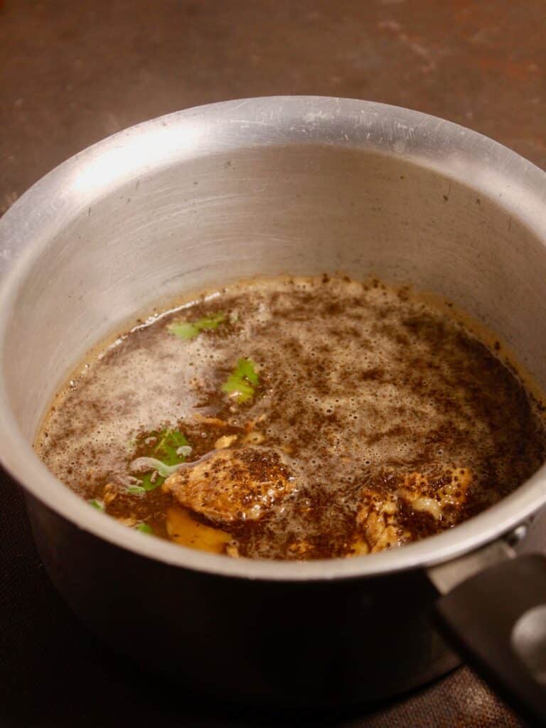 add tea leaves in the saucepan