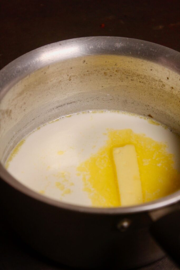 take milk with butter and sugar in a vessel and start to boil 