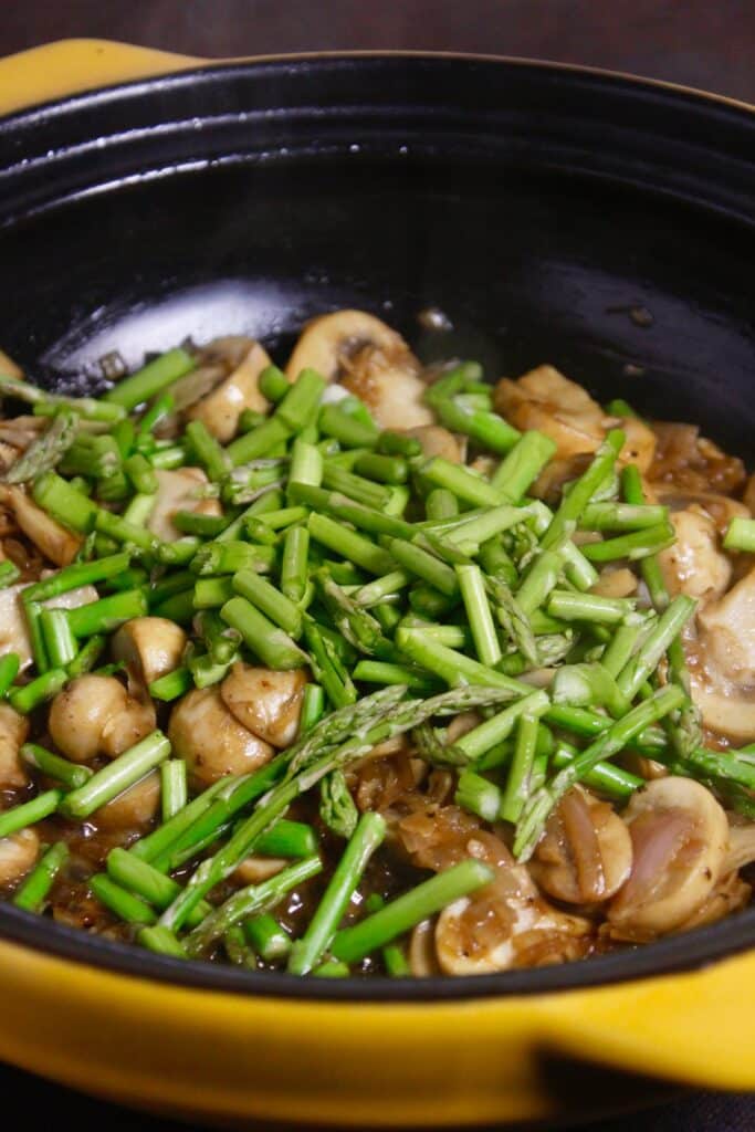 add asparagus to the pan and mix well 