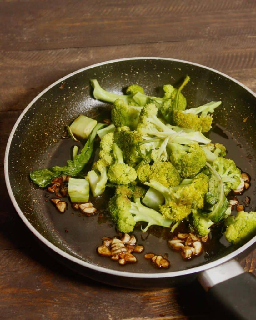 add cooked broccoli florets to the saute and mix 