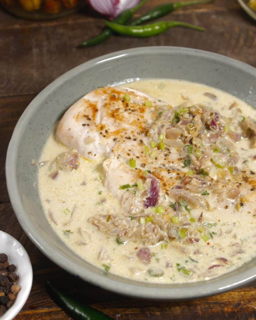 tasty chicken in cream sauce ready to enjoy with rice and roti