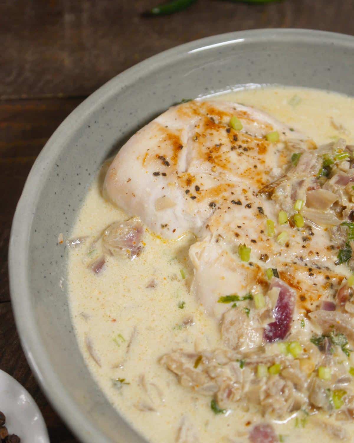 side view of chicken in cream sauce