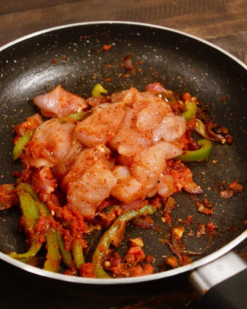 add marinated chicken to the pan 