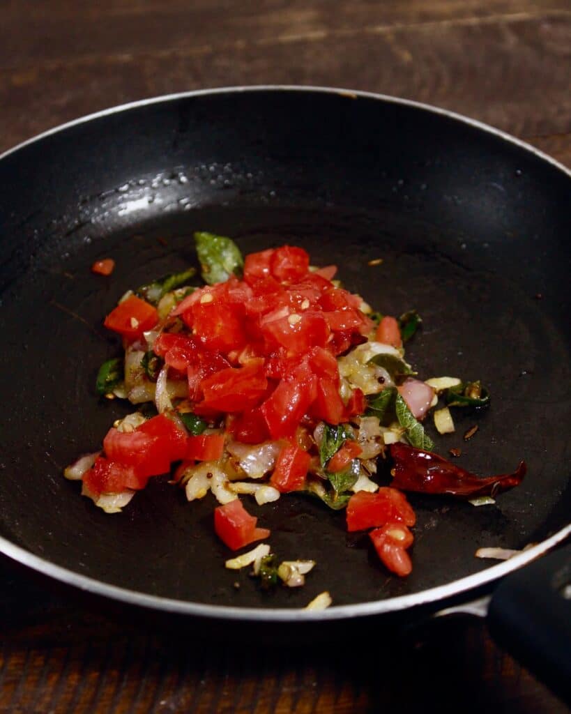 chopped tomatoes are added