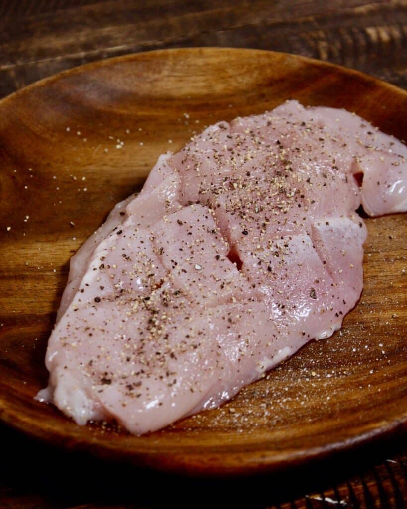 coat chicken breast with spices