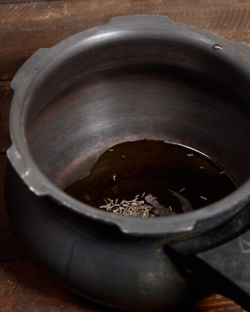 take seeds and oil in a pan 