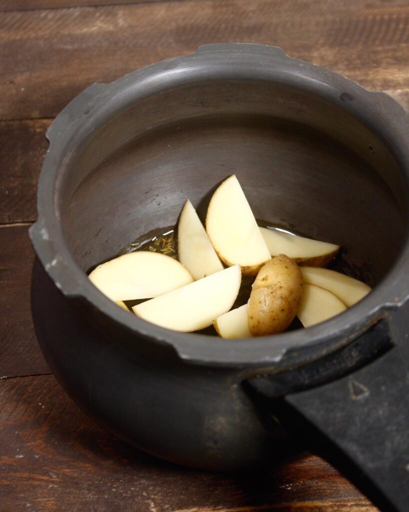 add some potatoes to the pan 