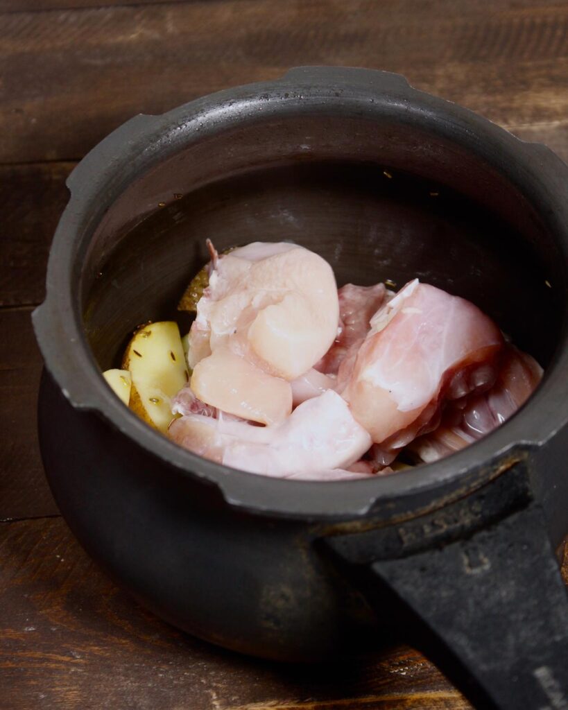 add some chicken pieces to the pan 