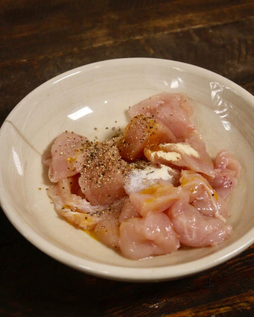 chicken pieces with powdered spices 