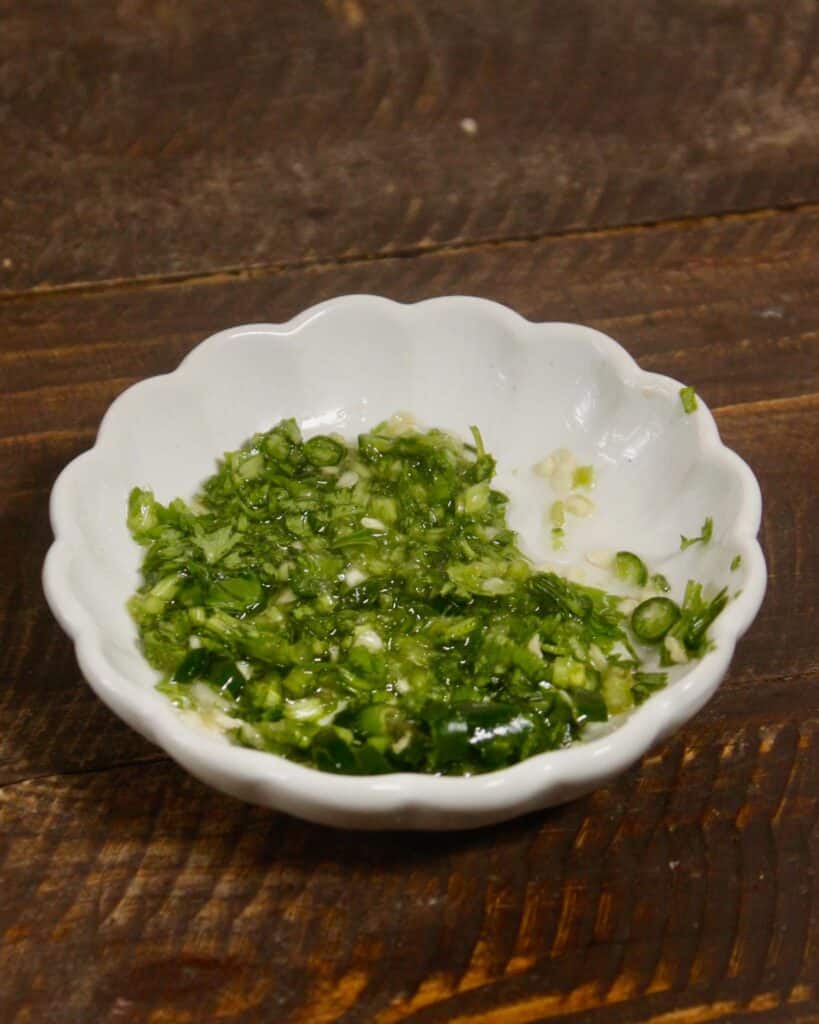take all the ingredients of green chili oil in a bowl