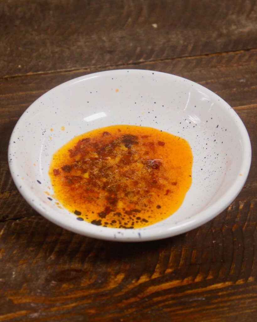 take all the ingredients of red chili oil in a bowl