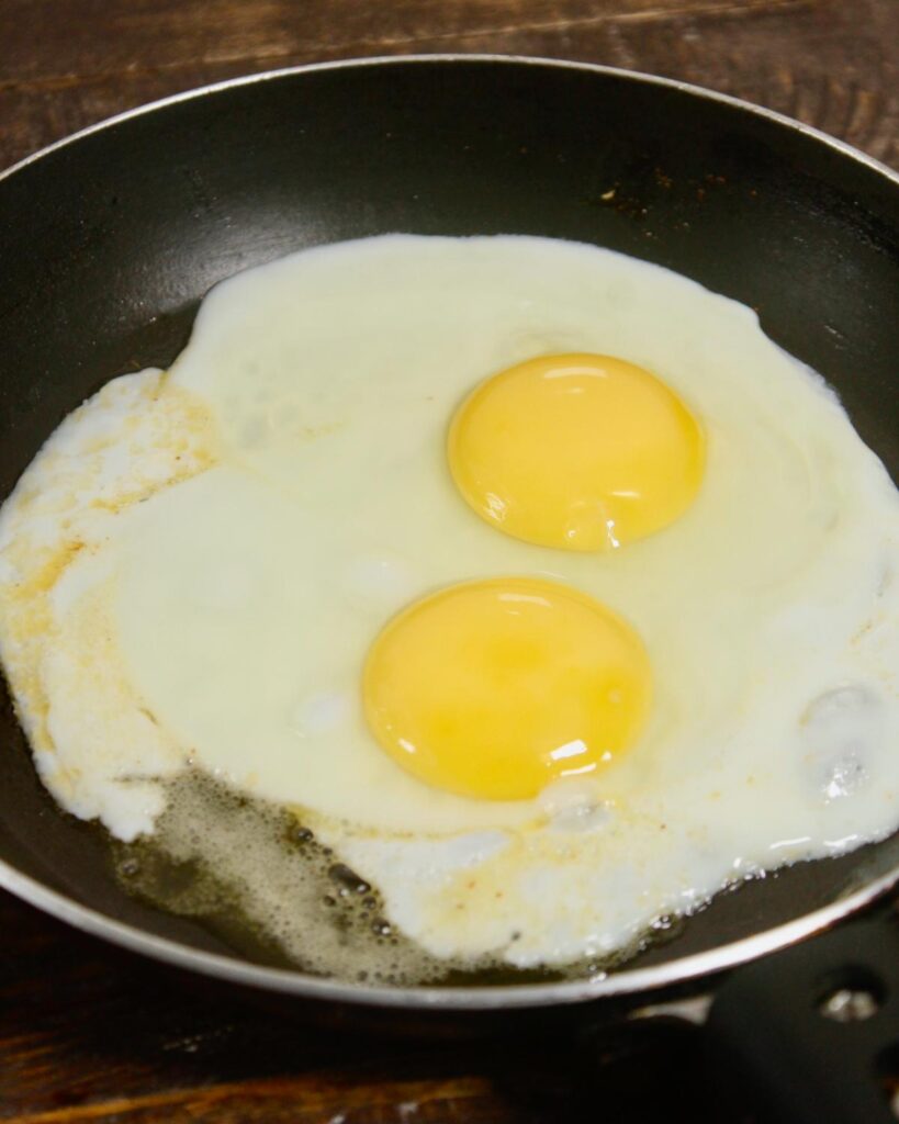 take two eggs in a pan and let it fry 