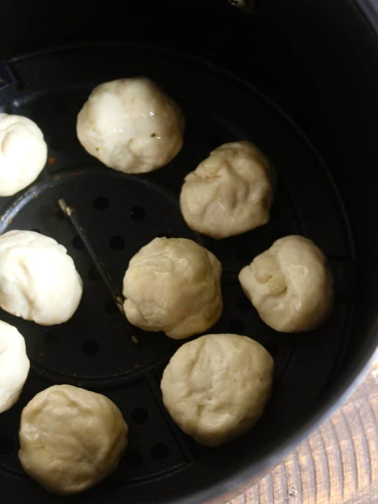 transfer the dough balls into the air fryer 