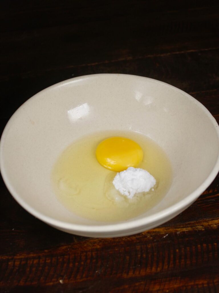 egg and powdered sugar in a bowl