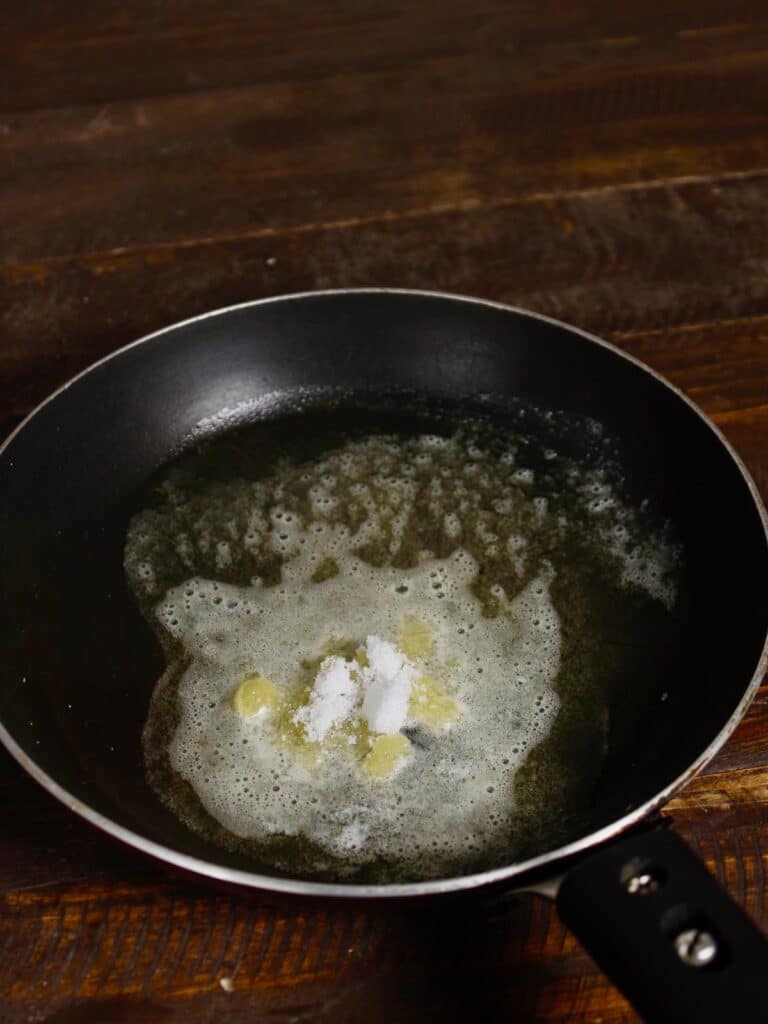 powdered sugar is added to the pan 