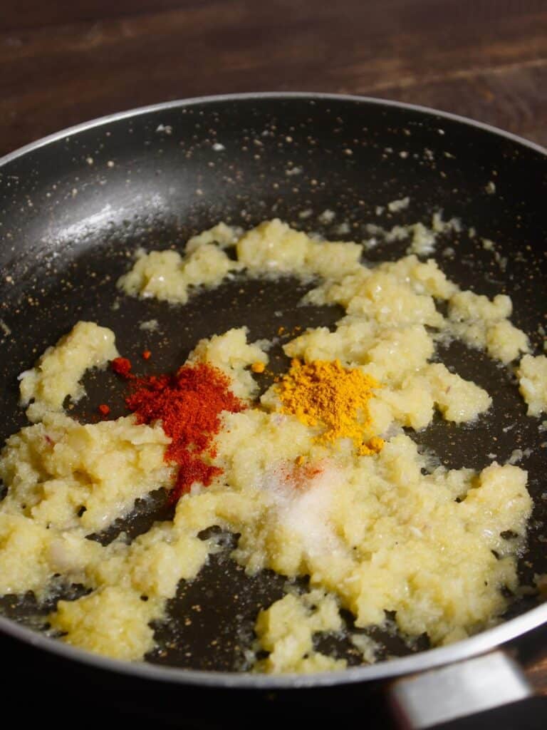 add powdered spices to the pan and saute 