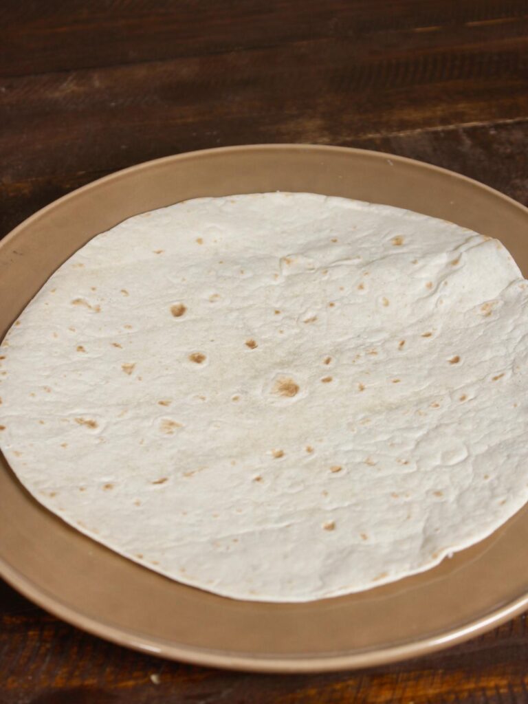 place tortilla on a plate 