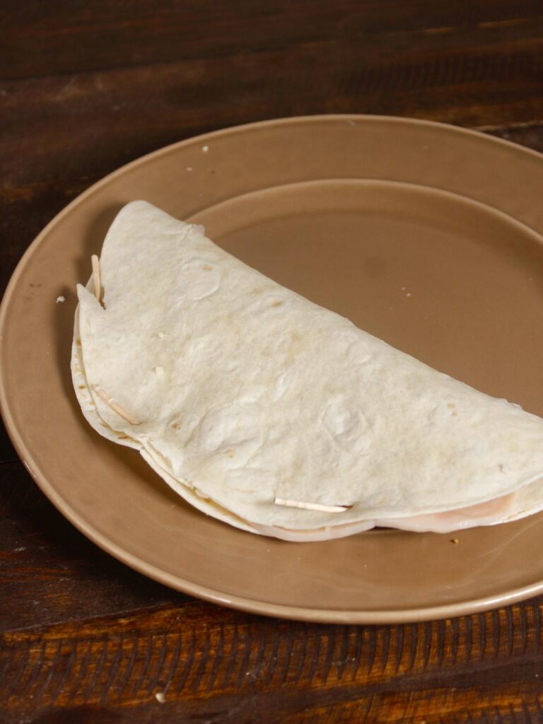 fold the tortilla into half 