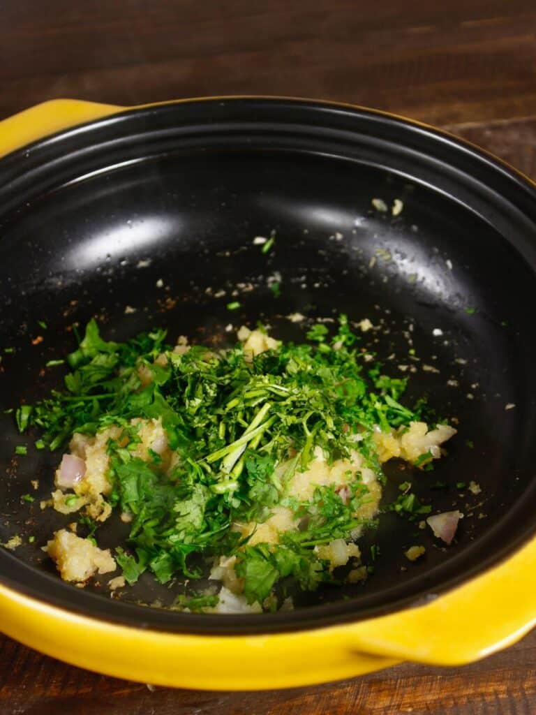 add some chopped coriander leaves to the pan 