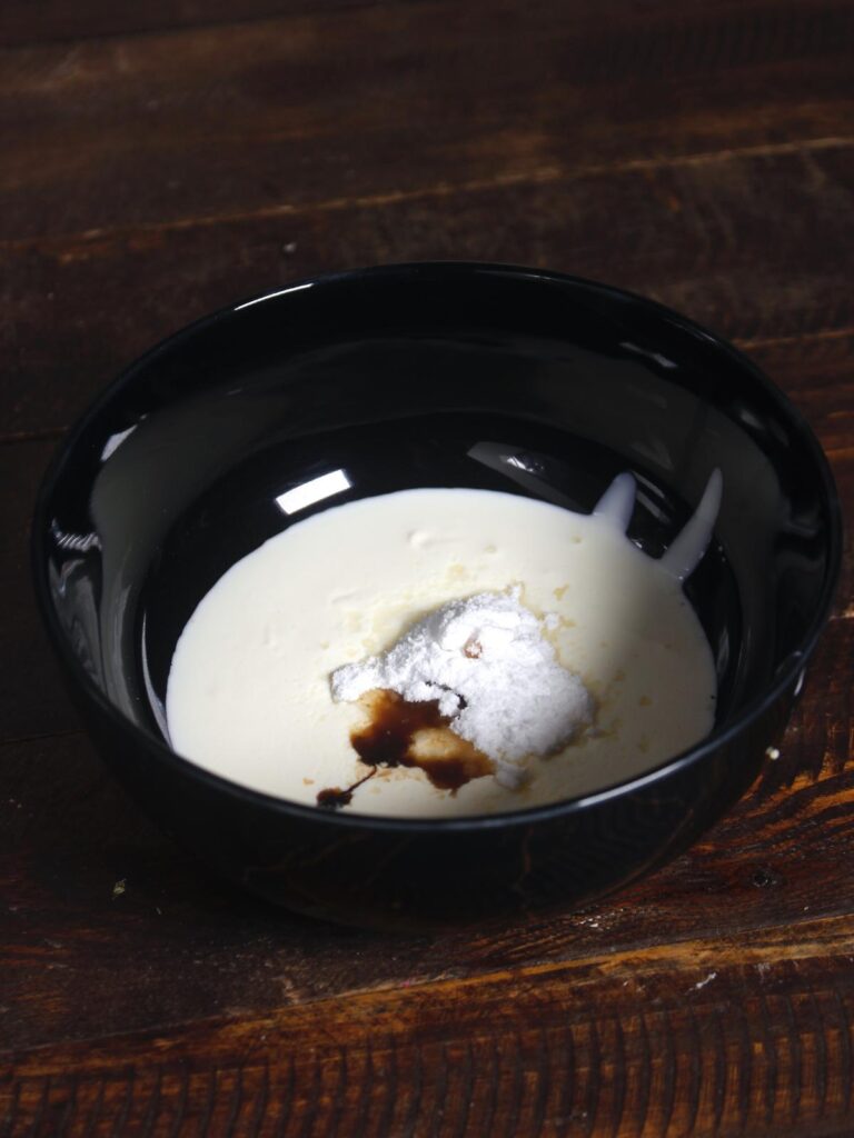 cream, sugar, vanilla essence in a bowl