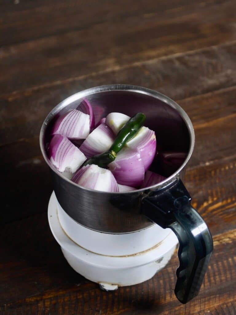 grind onion and green chilies into the paste  