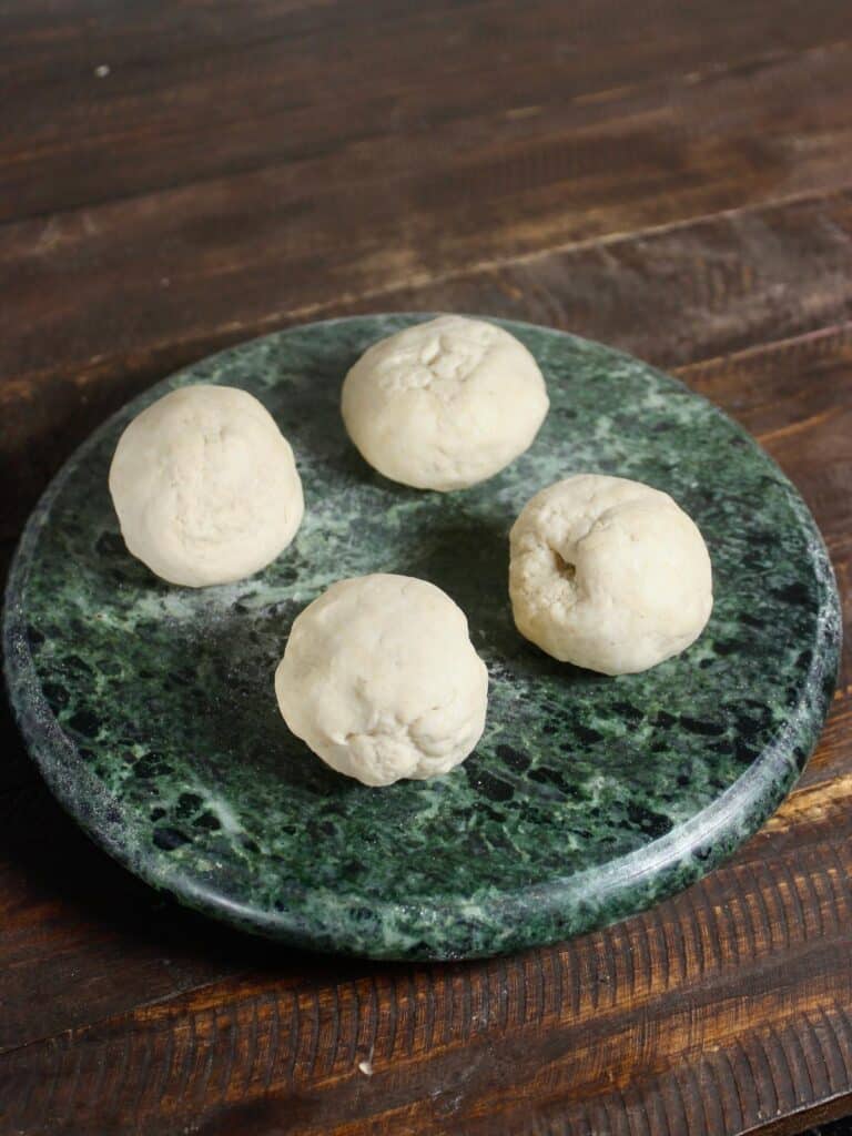 divide the dough into equal round balls
