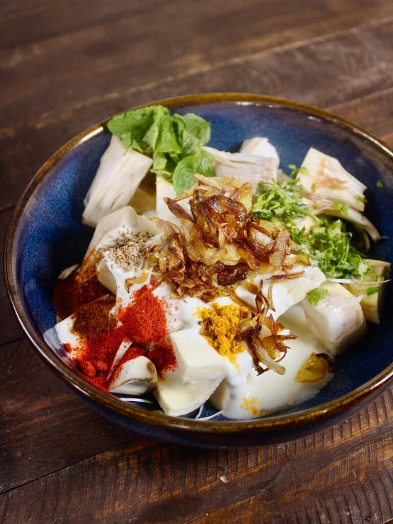 take jackfruit pieces and all ingredients in a bowl 