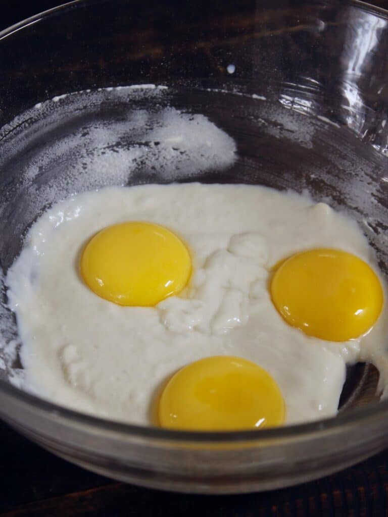 add egg yolks to the bowl 