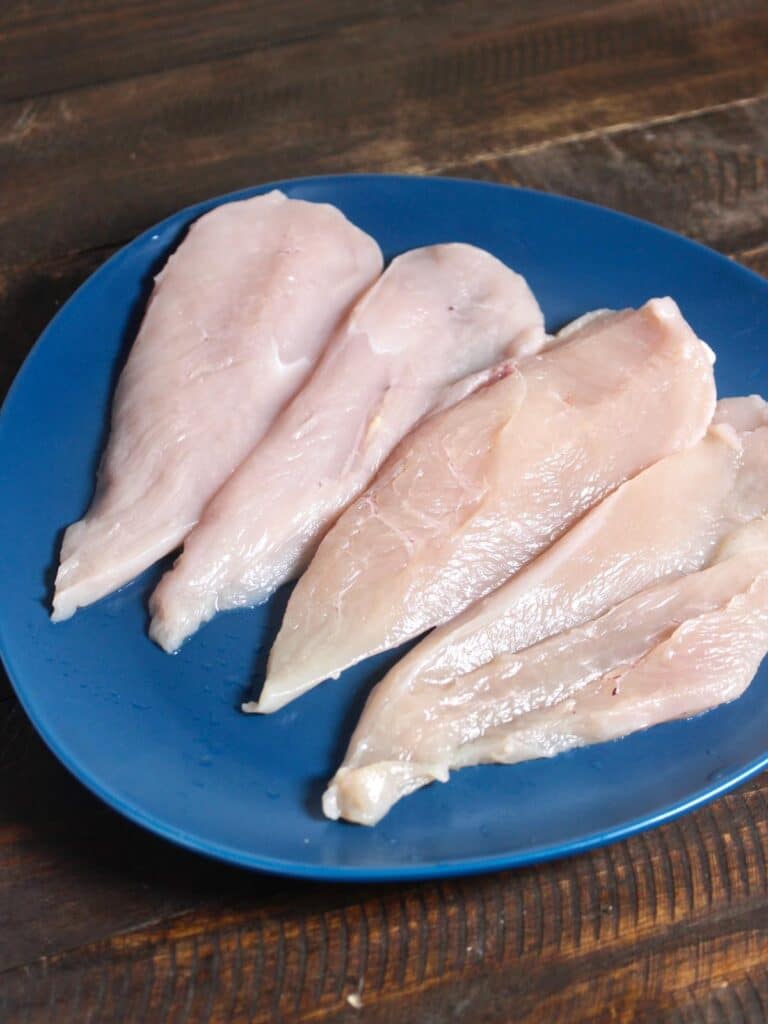 take chicken breast on a plate 