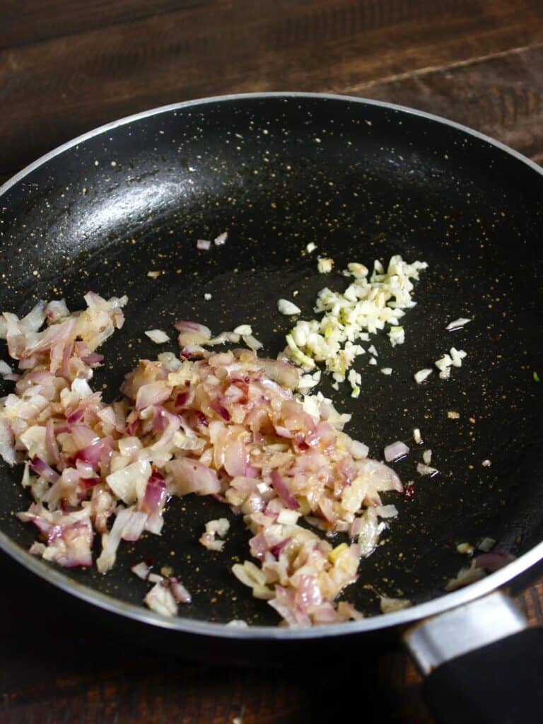 add chopped garlic to the pan 