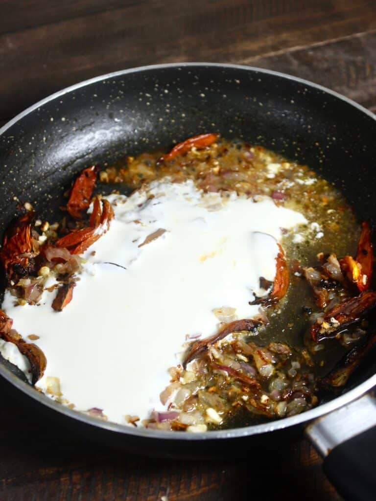 add heavy cream and chicken broth in the pan 