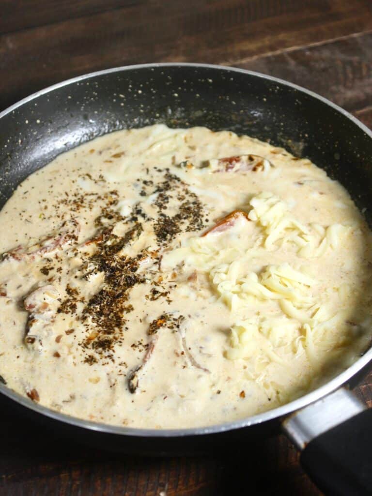 add cheese and powdered spices to the pan and cook well