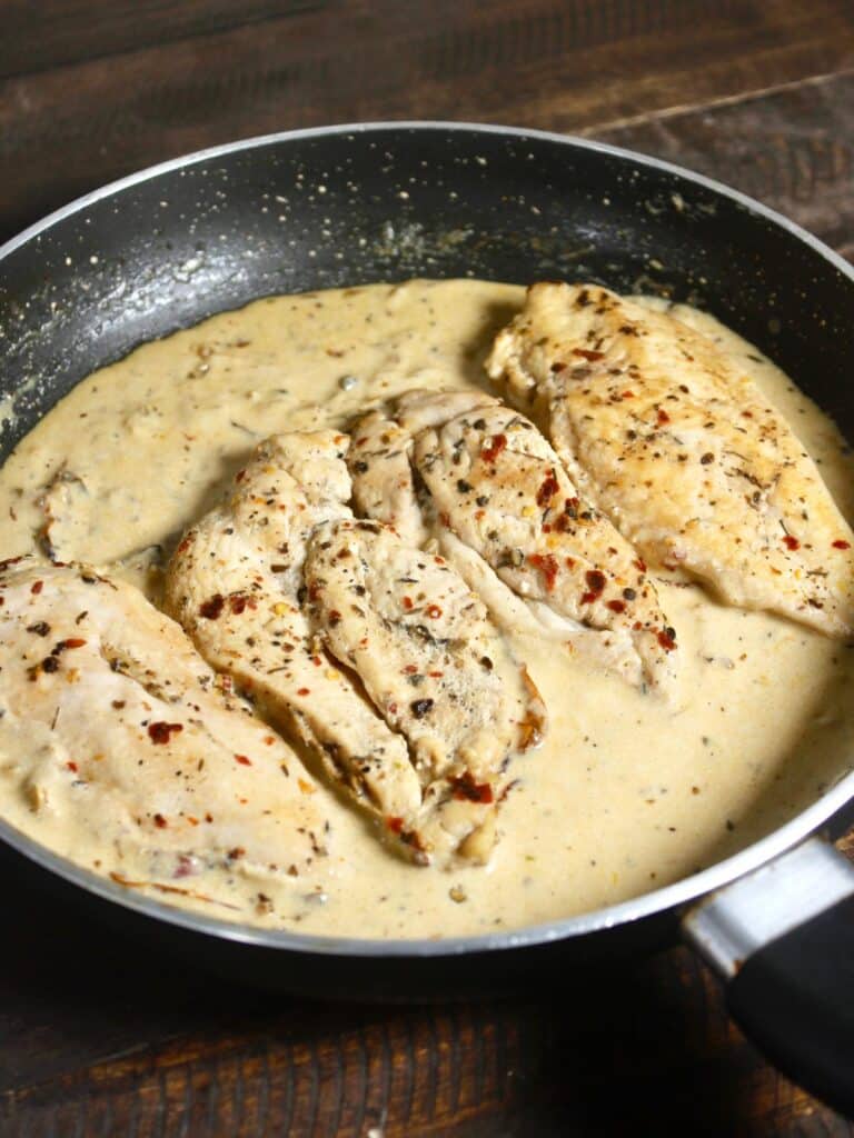 add cooked crunchy chicken pieces  to the pan and cook 