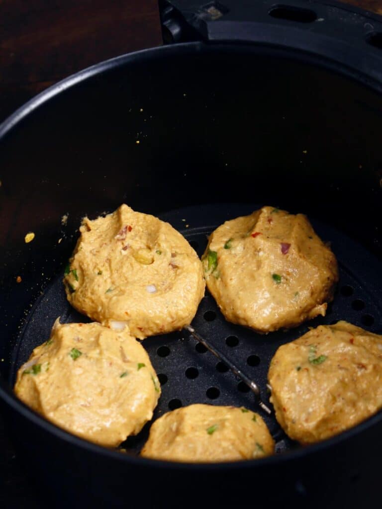 make small small discs of the kabab mix and transfer it into the air fryer basket 