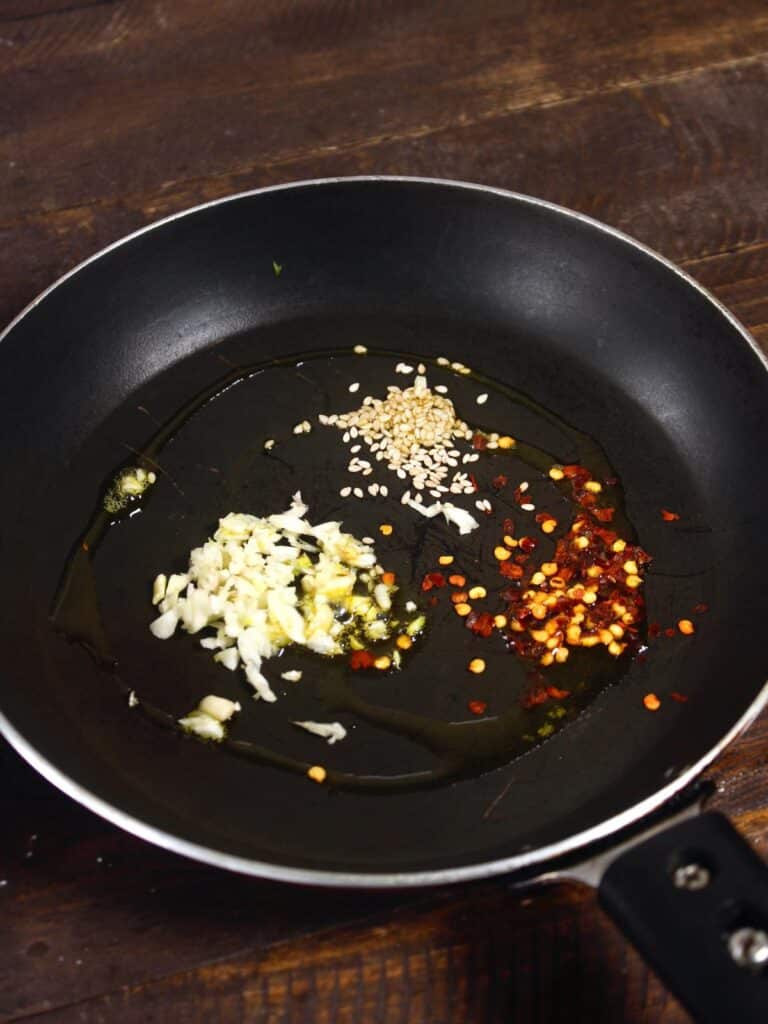 saute seeds and chopped garlic in another pan 