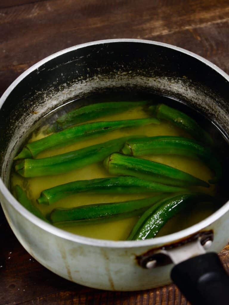 add salt and turmeric powder into the water 