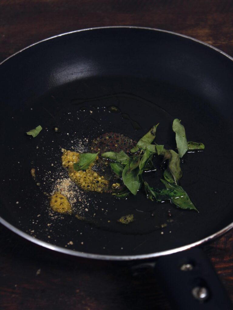 saute seeds, leaf and oil in a pan  