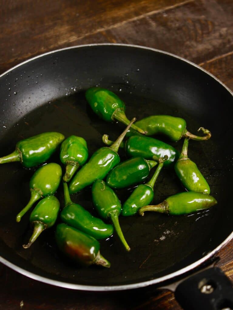 saute chillies in a pan 