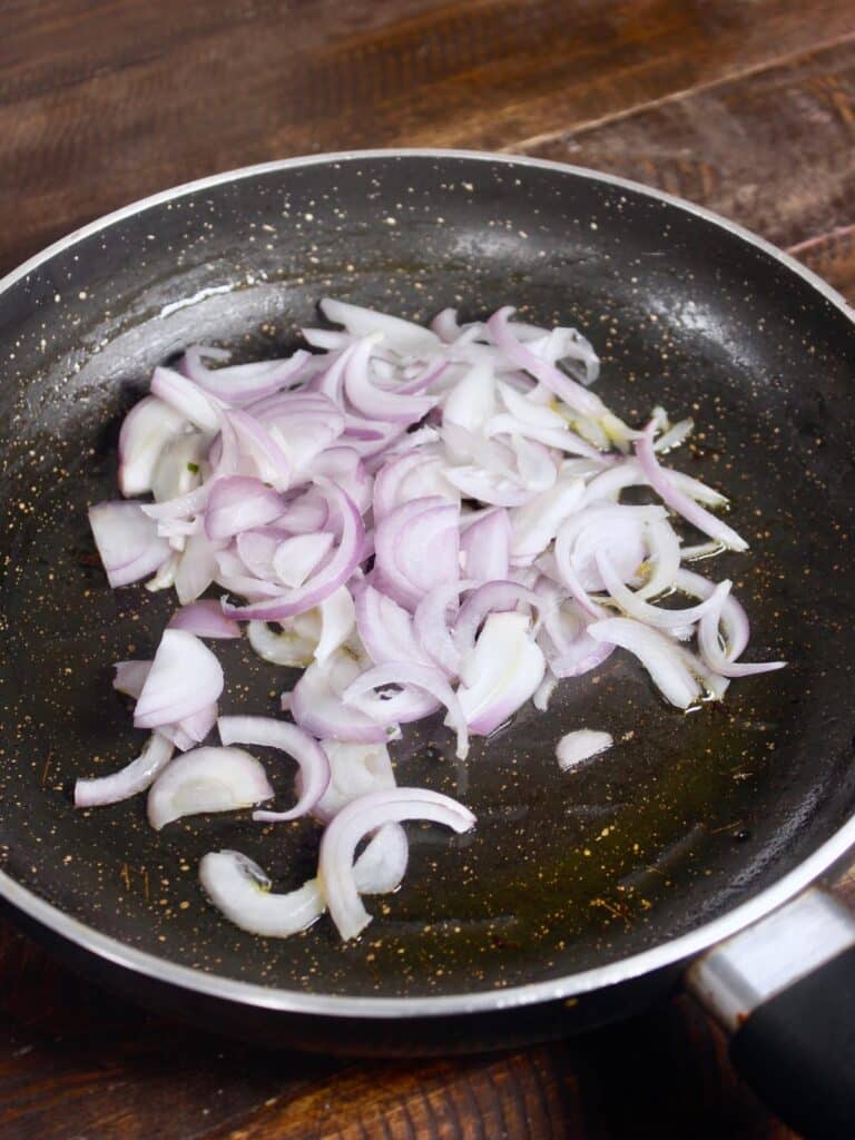 take onion slices in a pan 