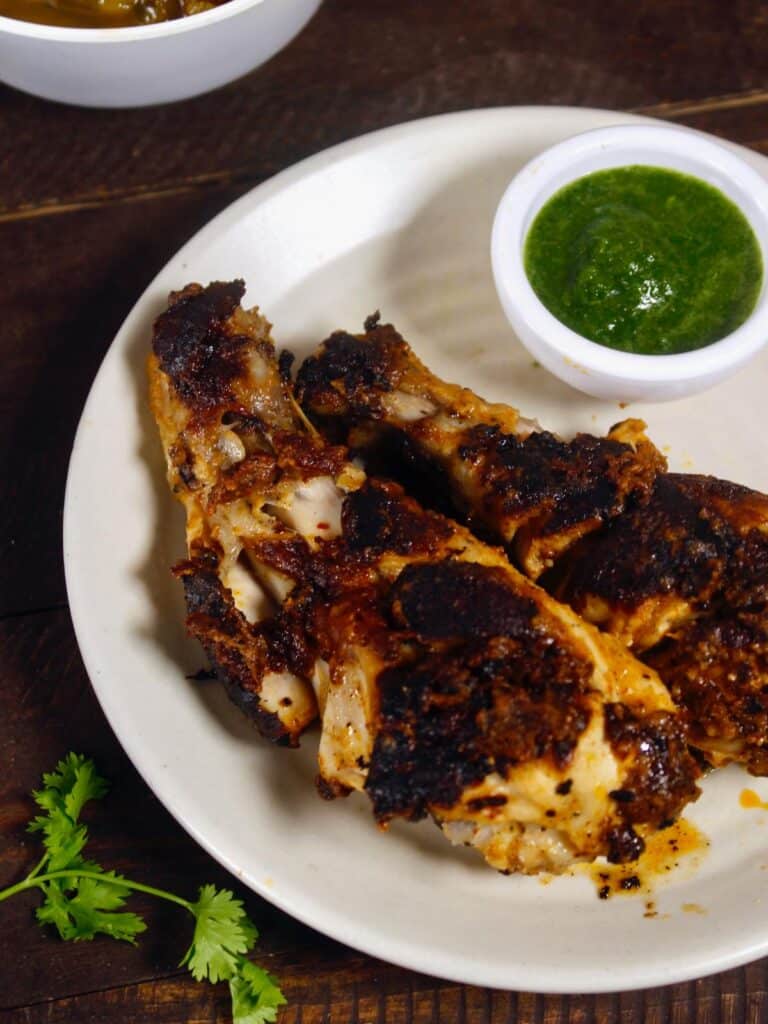 enjoy spicy viral tandoori chicken legs with green chutney 