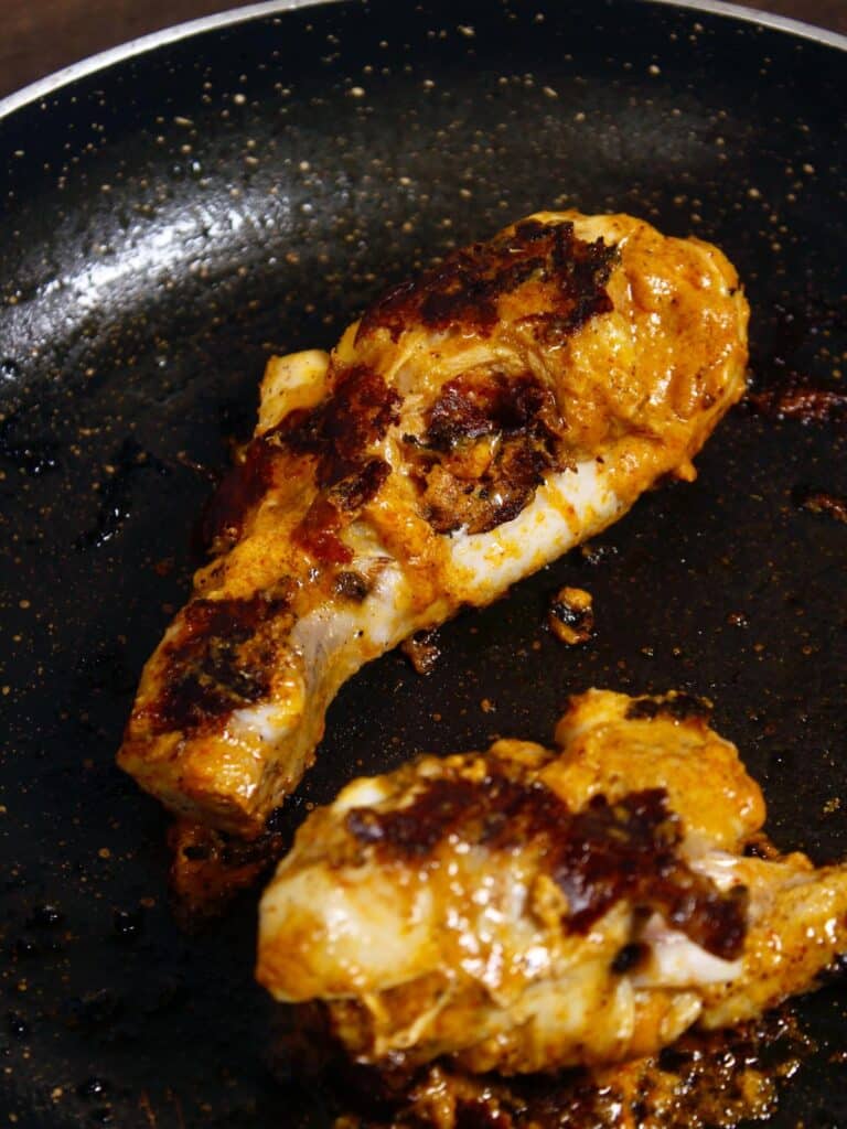 turn the chicken pieces until its cooked properly on both the sides 